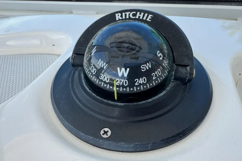 Slide: The Image of Ritchie compass on 2022 Robalo 266 Cayman boat dashboard. - 45