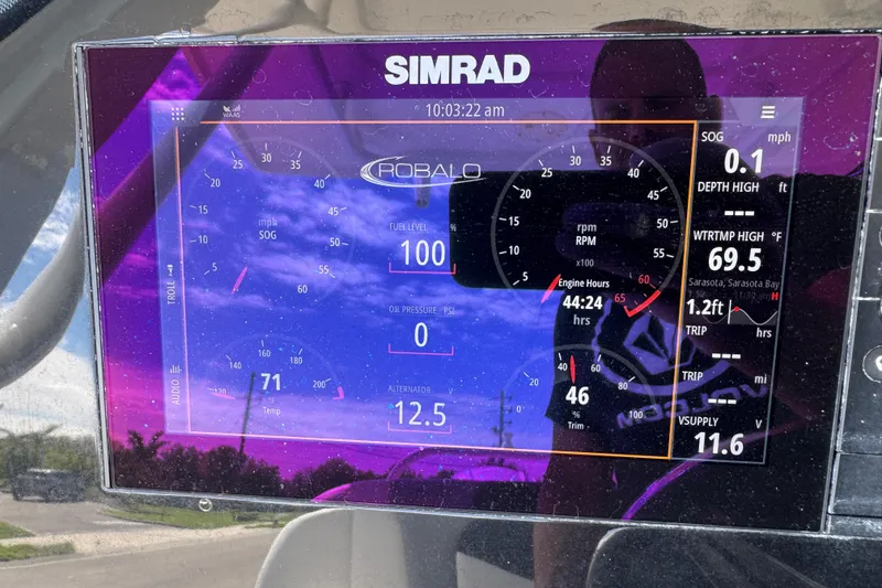 Slide: The Image of Simrad display on 2022 Robalo 266 Cayman showing engine and navigation data. - 47