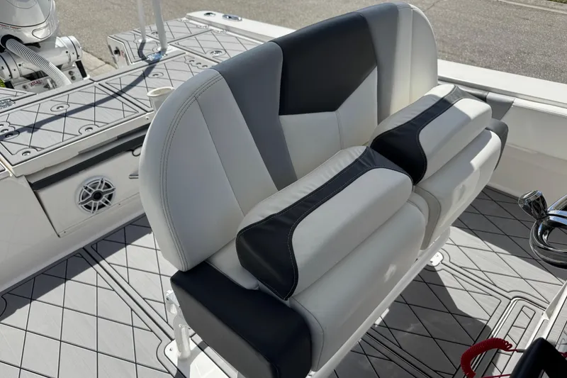 Slide: The Image of 2022 Robalo 266 Cayman boat interior with cushioned seating and modern design. - 51