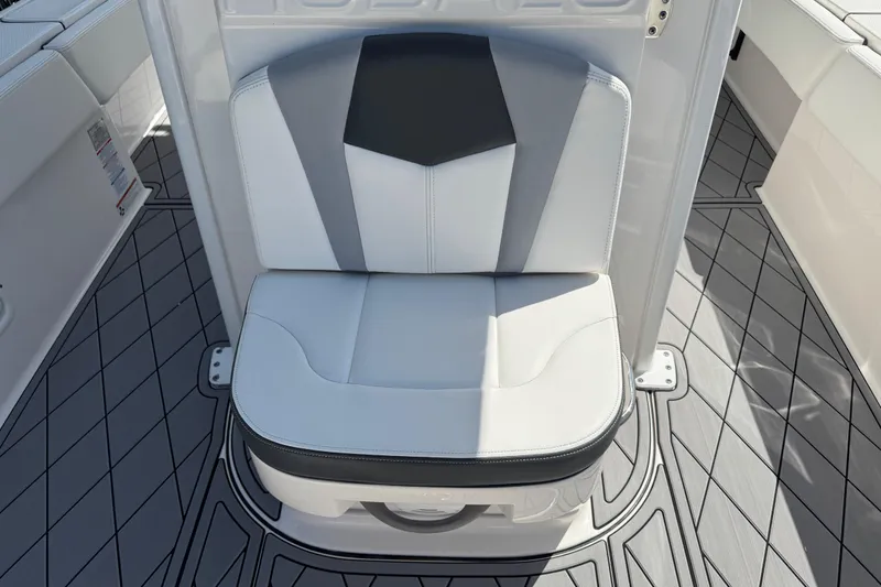 Slide: The Image of 2022 Robalo 266 Cayman boat seat with modern design and gray flooring. - 57