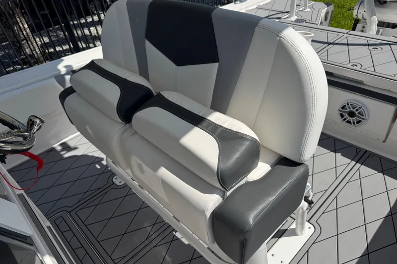 Slide: The Image of 2022 Robalo 266 Cayman boat seating with gray and white upholstery. - 71