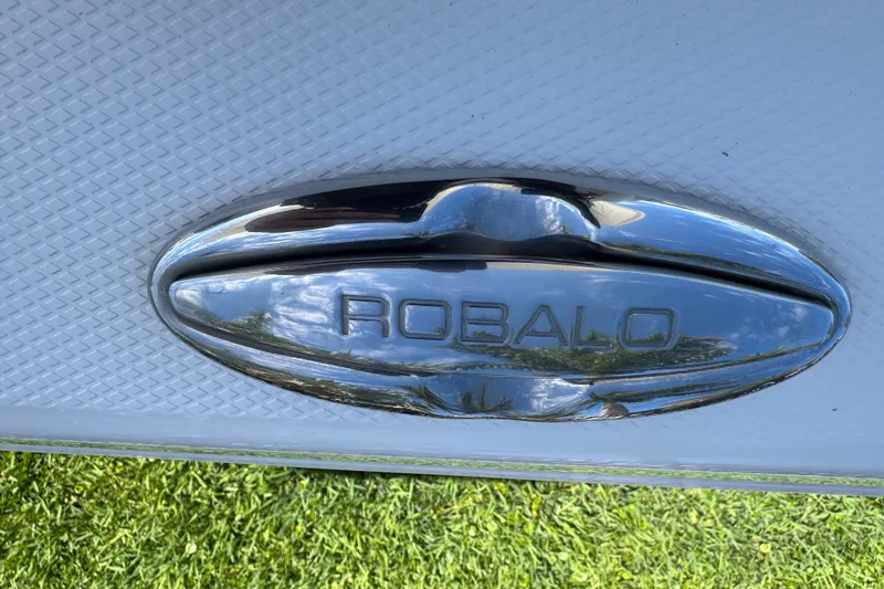 Slide: The Image of Chrome Robalo logo on 2022 Robalo 266 Cayman boat deck. - 72