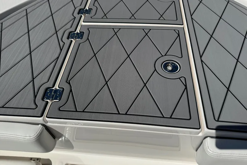 Slide: The Image of 2022 Robalo 266 Cayman boat deck with sleek, modern design and diamond pattern. - 78