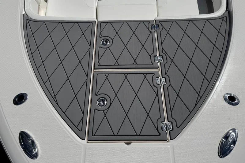 Slide: The Image of 2022 Robalo 266 Cayman boat deck with diamond-patterned non-slip surface. - 83