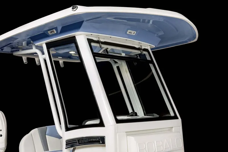 Slide: The Image of 2022 Robalo 266 Cayman boat with sleek blue exterior and chrome logo. - 9