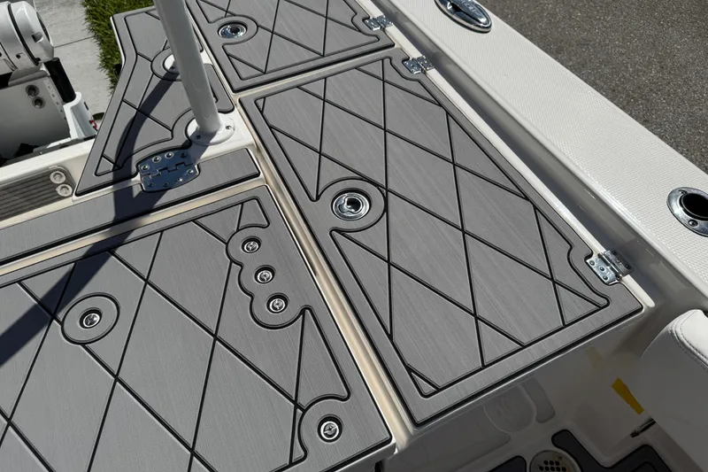 Slide: The Image of 2022 Robalo 266 Cayman boat deck with sleek, modern design and storage compartments. - 91