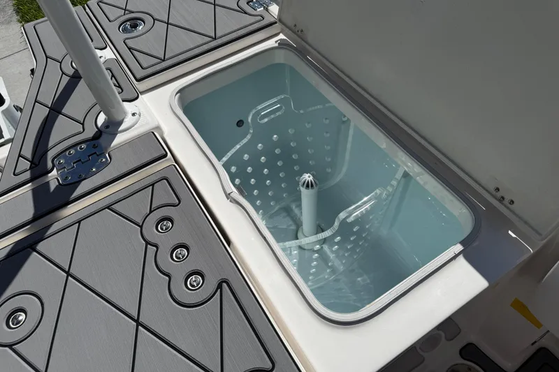 Slide: The Image of 2022 Robalo 266 Cayman boat deck with storage compartment open. - 93