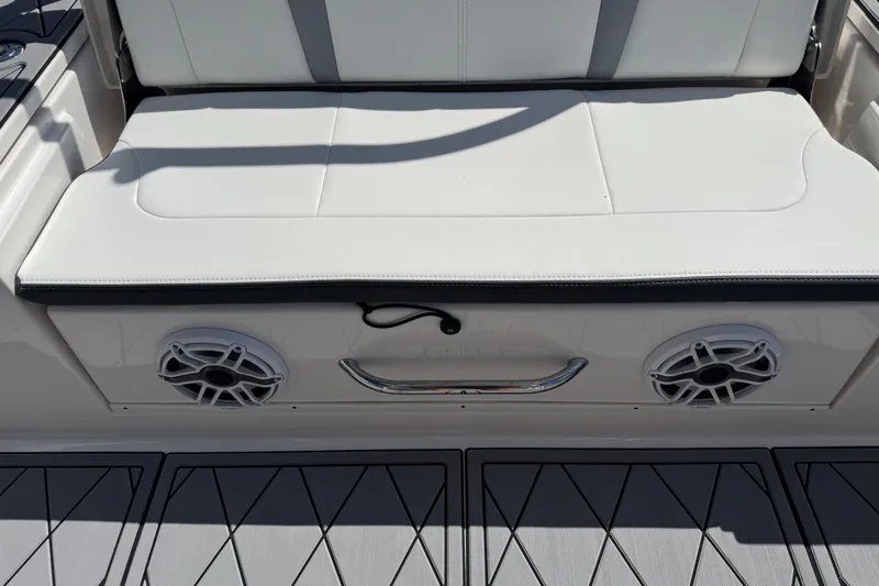 Slide: The Image of 2022 Robalo 266 Cayman boat seat with speakers and sleek design. - 97