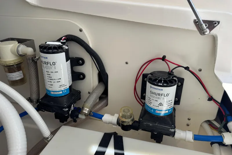 Slide: The Image of 2022 Robalo 266 Cayman boat with Shurflo pumps and wiring setup. - 99