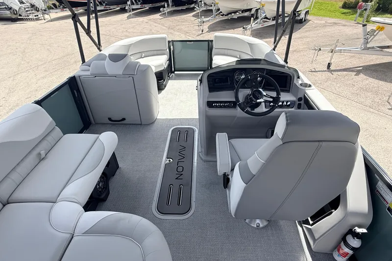 Slide: The Image of 2026 Avalon 2385 LSZ Rear Fish Tri Toon interior with modern seating and steering console. - 11