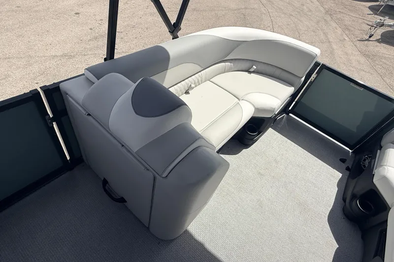 Slide: The Image of 2026 Avalon 2385 LSZ Tri Toon boat with plush seating and high-performance design. - 12