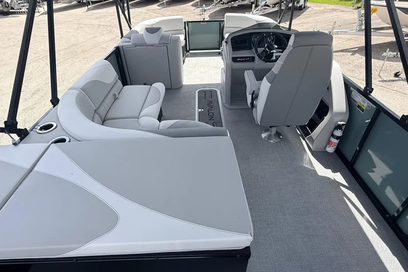 Slide: The Image of 2026 Avalon 2385 LSZ Rear Fish Tri Toon interior with plush seating and modern helm. - 20