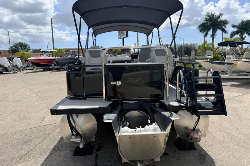 Slide: The Image of 2026 Avalon 2385 LSZ Rear Fish Tri Toon boat, high performance, parked outdoors. - 6