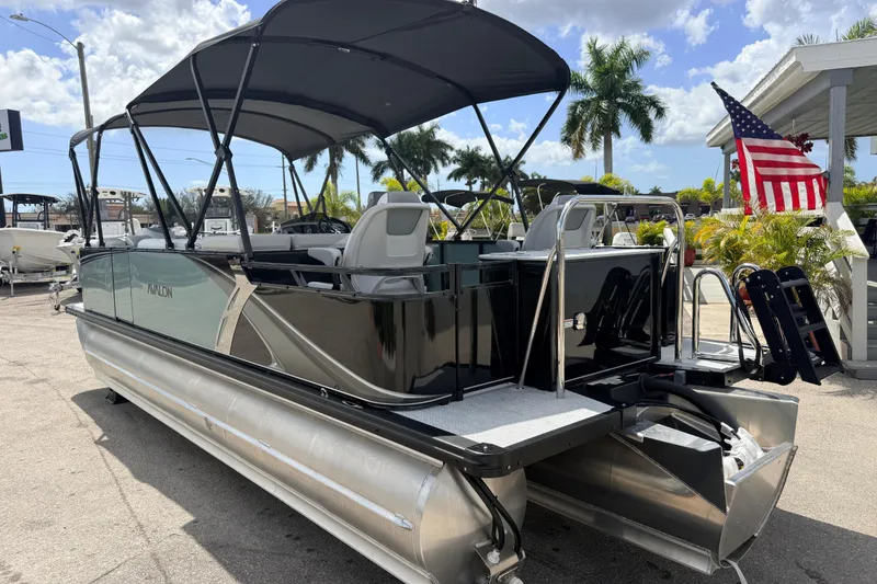Slide: The Image of 2026 Avalon 2385 LSZ Rear Fish Tri Toon boat with canopy, parked outdoors. - 7