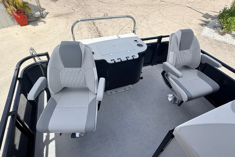 Slide: The Image of 2026 Avalon 2385 LSZ Rear Fish boat interior with two swivel seats and a central console. - 9