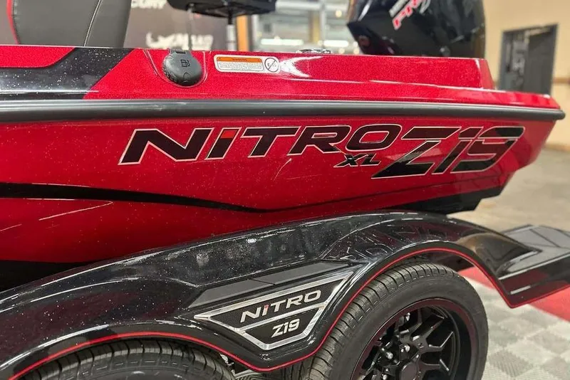 Slide: The Image of 2026 Nitro Z19 XL Pro boat, red and black design, close-up view. - 15