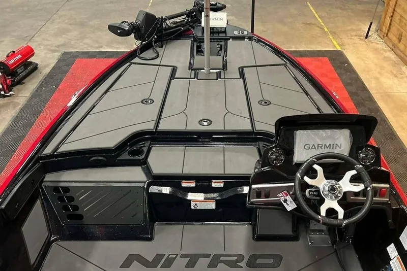 Slide: The Image of 2026 Nitro Z19 XL Pro boat interior with Garmin navigation system and sleek steering wheel. - 16