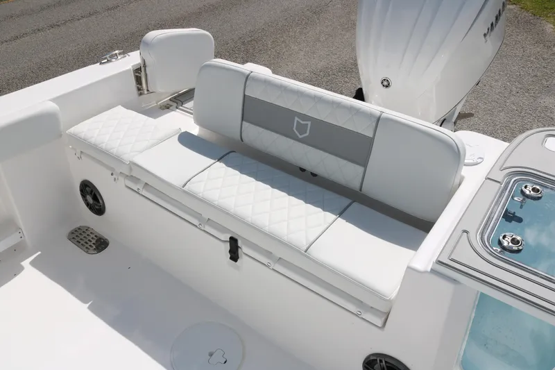 Slide: The Image of 2026 Sea Fox 248 Commander boat with white cushioned seating and sleek design. - 12