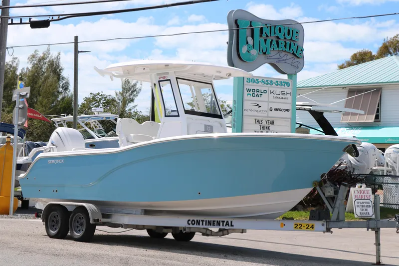 Slide: The Image of 2026 Sea Fox 248 Commander boat on trailer at Unique Marine dealership. - 3