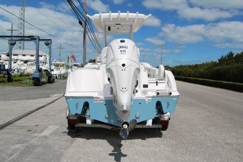 Slide: The Image of 2026 Sea Fox 248 Commander boat with powerful 300 V6 engine, parked on a sunny day. - 5