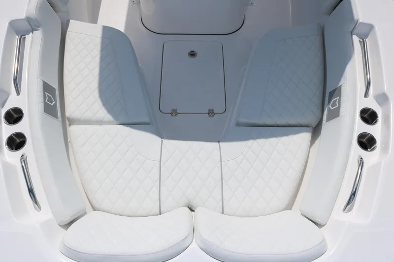 Slide: The Image of 2026 Sea Fox 248 Commander boat interior with white quilted seating and stainless steel accents. - 8
