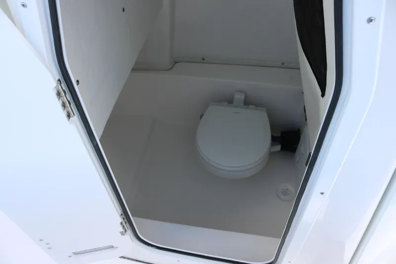 Slide: The Image of 2026 Sea Fox 248 Commander boat interior with compact marine toilet. - 9