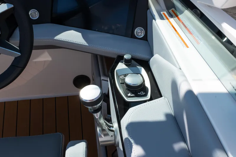 Slide: The Image of 2026 MasterCraft X24 boat with teak swim platform and luxurious seating. - 14