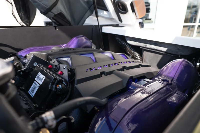 Slide: The Image of 2026 MasterCraft X24 boat interior with sleek gray and tan seating design. - 17