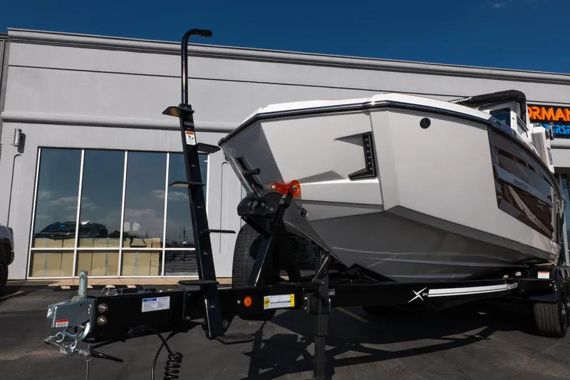 Slide: The Image of 2026 MasterCraft X24 boat interior with modern seating and sleek dashboard design. - 19