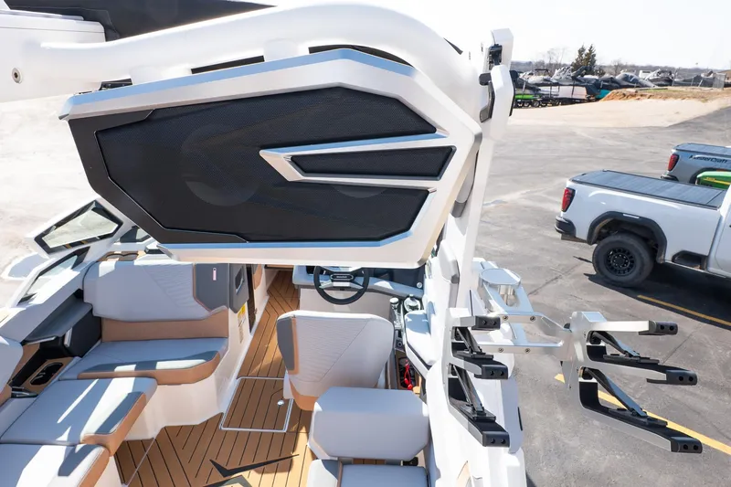 Slide: The Image of 2026 MasterCraft X24 boat interior with modern seating and advanced audio system. - 21