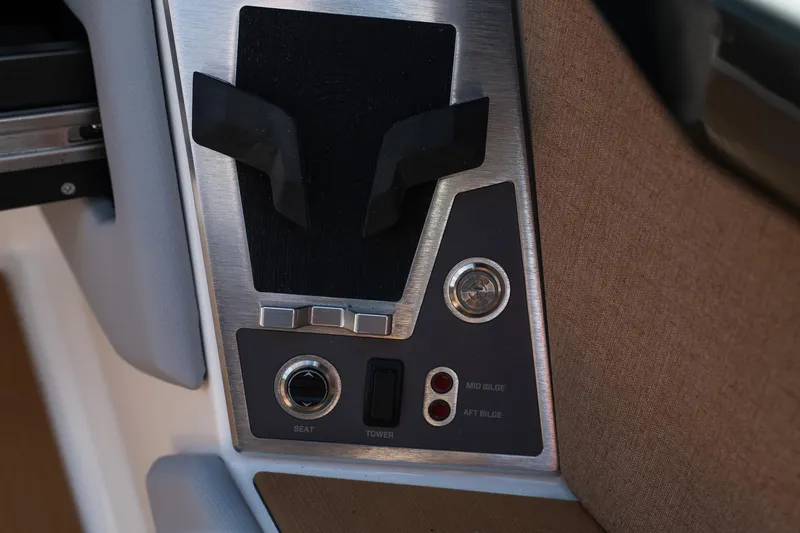 Slide: The Image of Control panel of 2026 MasterCraft X24 boat with switches and buttons. - 23