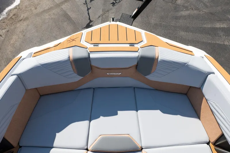 Slide: The Image of 2026 MasterCraft X24 boat interior with luxurious seating and modern design. - 30