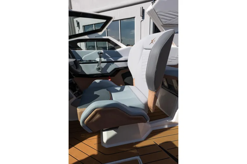 Slide: The Image of 2026 MasterCraft X24 interior with modern helm seat and sleek design. - 33
