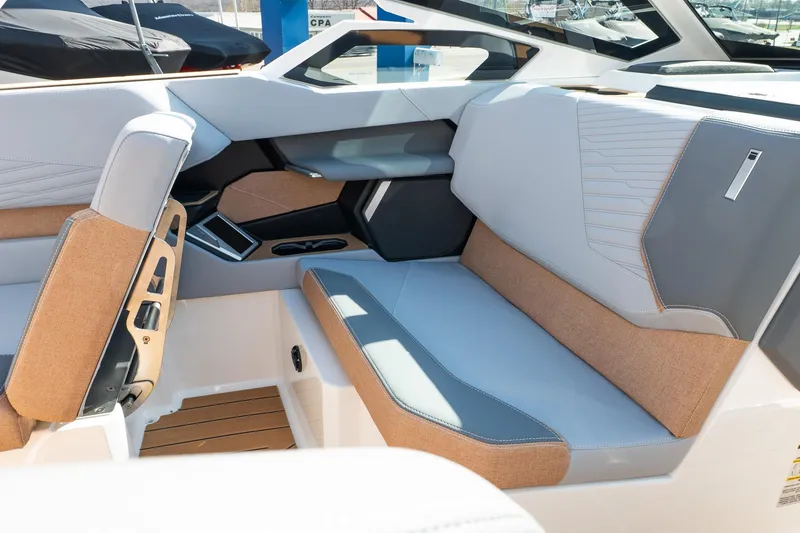 Slide: The Image of 2026 MasterCraft X24 boat interior with modern seating and sleek design. - 36