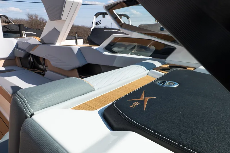 Slide: The Image of 2026 MasterCraft X24 boat interior with luxurious seating and modern design elements. - 37