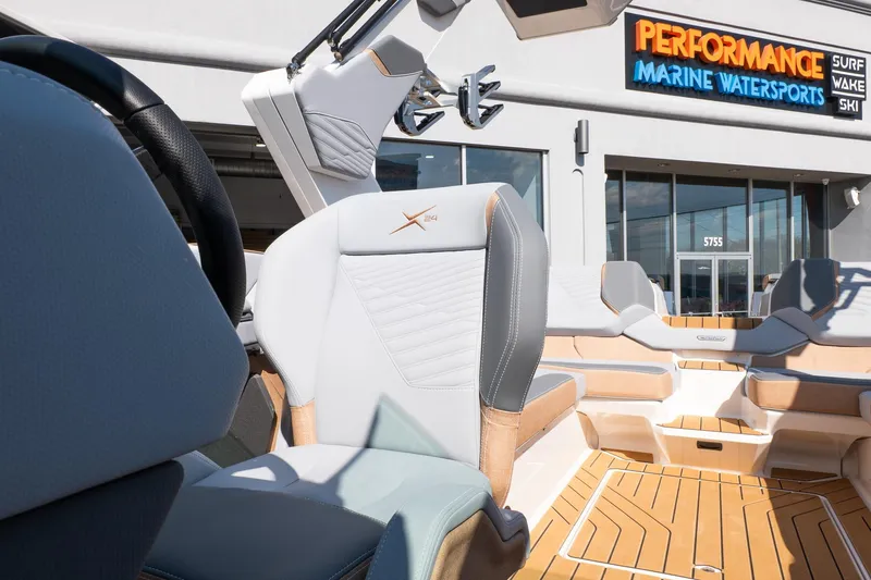 Slide: The Image of 2026 MasterCraft X24 boat interior at Performance Marine Watersports dealership. - 38