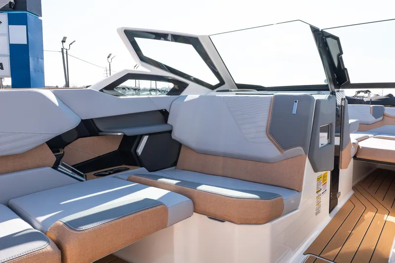 Slide: The Image of 2026 MasterCraft X24 boat interior with luxurious seating and modern design. - 43
