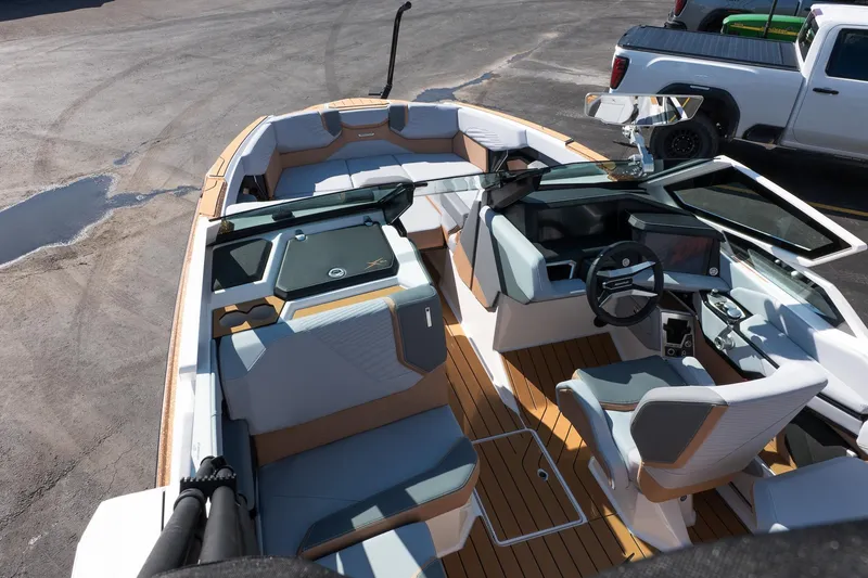 Slide: The Image of 2026 MasterCraft X24 boat interior with modern seating and dashboard design. - 48