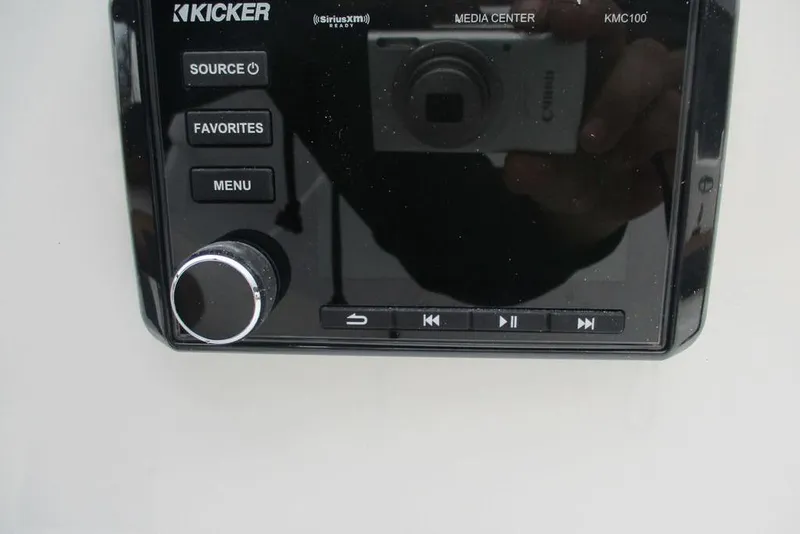 Slide: The Image of Kicker media center in 2026 Tahoe 2150 boat, featuring control buttons and display. - 10