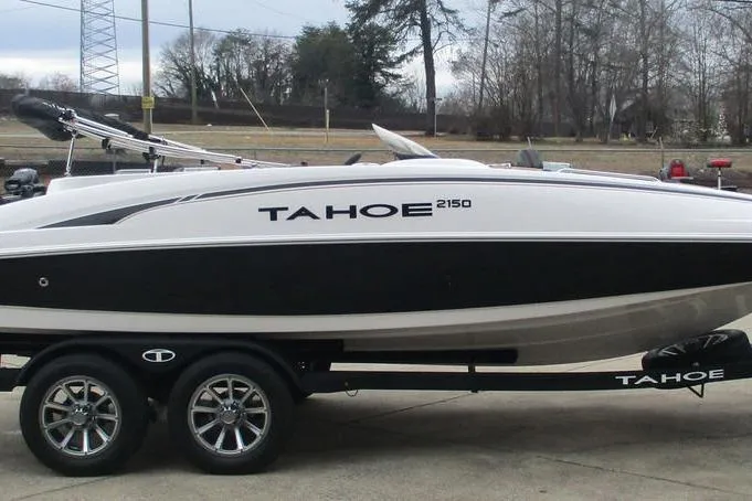 Slide: The Image of 2026 Tahoe 2150 boat on trailer, sleek design, black and white color scheme. - 3