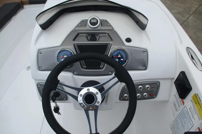 Slide: The Image of Steering console of 2026 Tahoe 2150 boat with gauges and controls. - 4