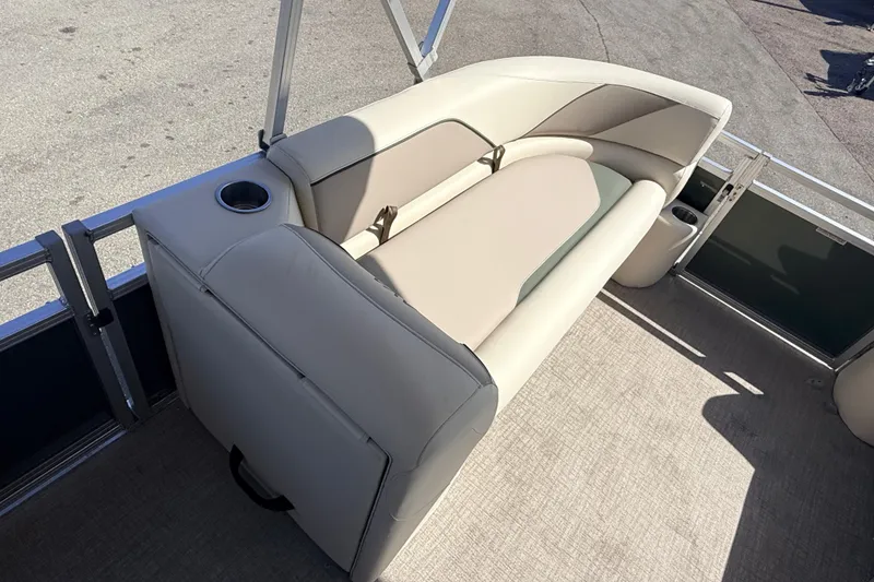 Slide: The Image of 2026 Avalon 2385 Venture 85 Quad Lounger interior with beige seating and cup holder. - 15