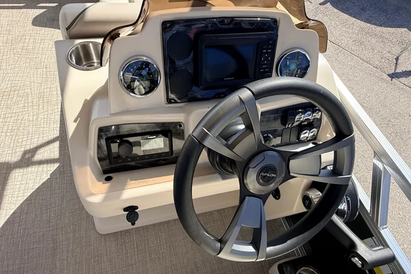 Slide: The Image of Steering console of 2026 Avalon 2385 Venture 85 Quad Lounger, featuring modern controls and displays. - 21