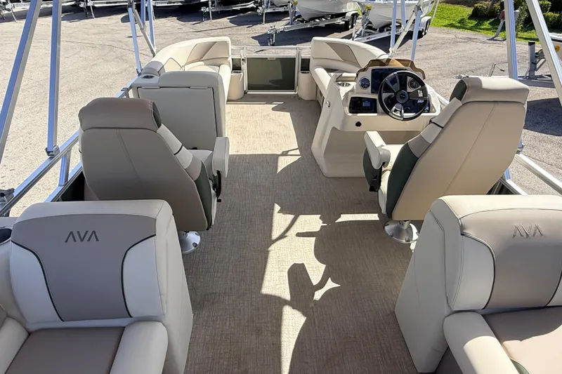 Slide: The Image of 2026 Avalon 2385 Venture 85 Quad Lounger interior with luxurious seating and modern helm. - 25