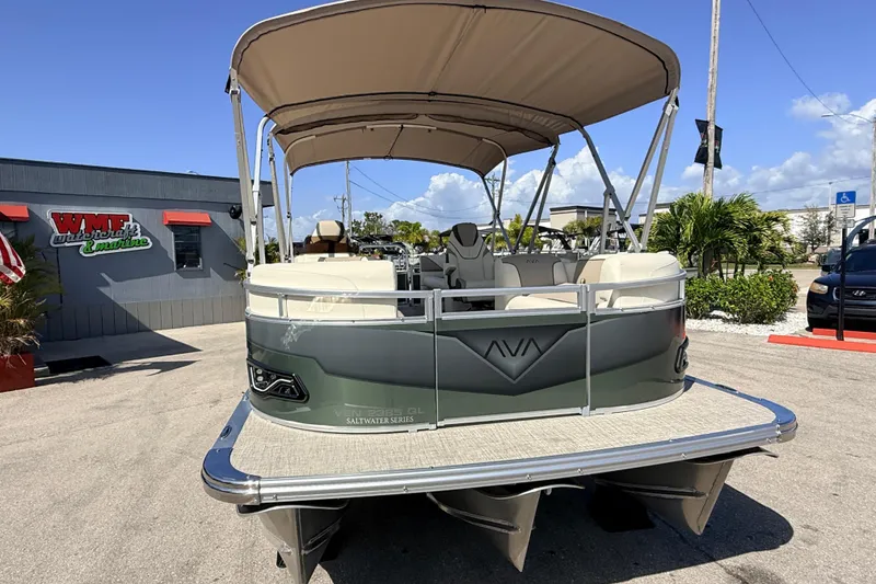 Slide: The Image of 2026 Avalon 2385 Venture 85 Quad Lounger Tri Toon boat at dealership, rear view. - 5