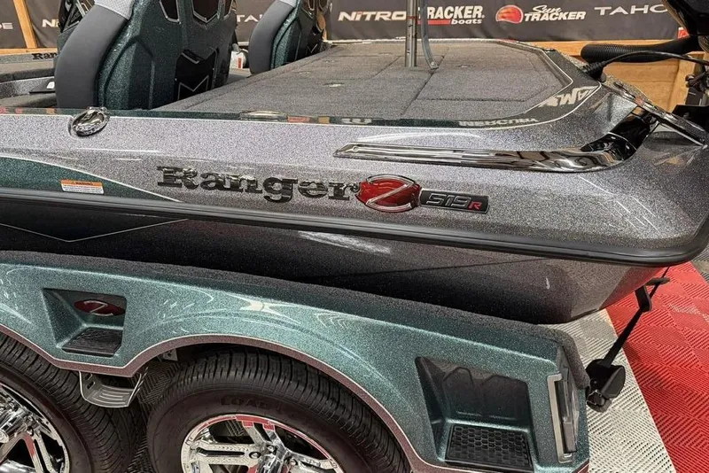 Slide: The Image of 2026 Ranger Z519R Cup-Equipped boat, sleek design with metallic finish and dual wheels. - 12