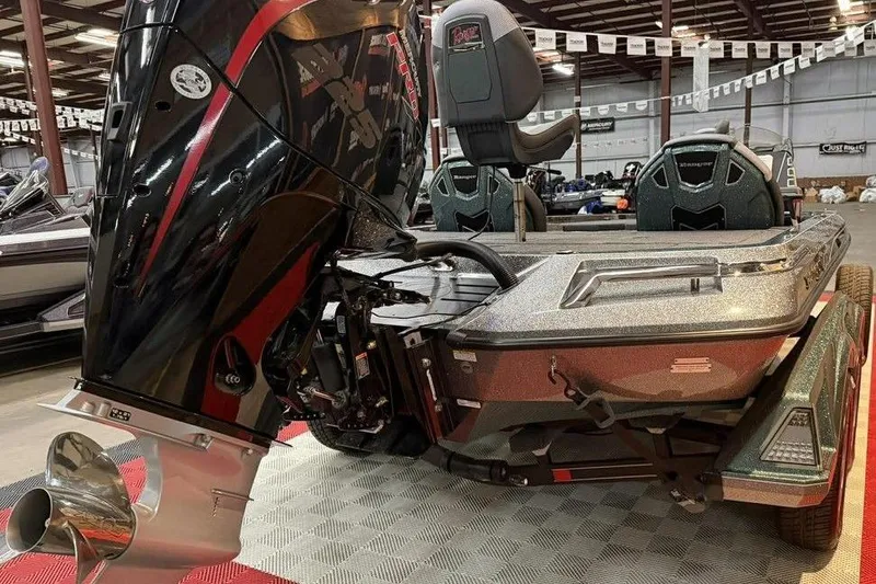 Slide: The Image of 2026 Ranger Z519R Cup-Equipped boat with powerful outboard motor in showroom. - 6