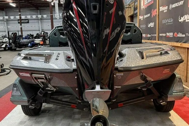 Slide: The Image of 2026 Ranger Z519R Cup-Equipped boat in showroom, rear view with motor and trailer. - 8