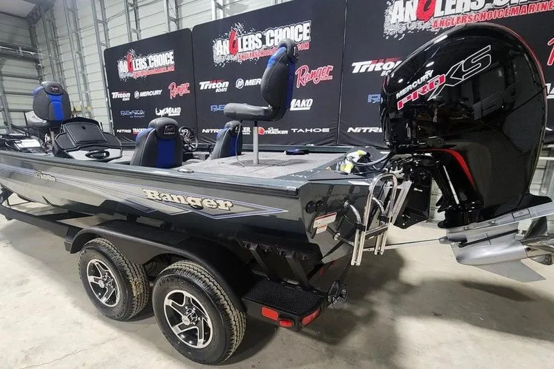 Slide: The Image of 2026 Ranger RT198P fishing boat with Mercury Pro XS engine in showroom. - 3