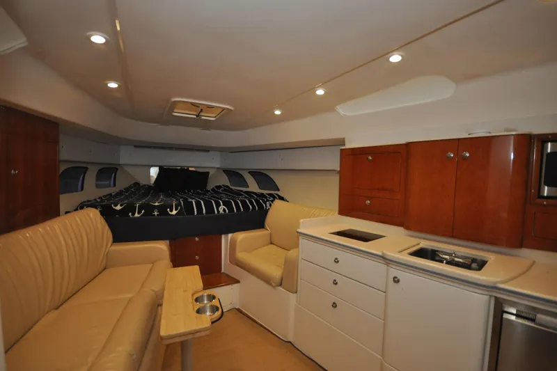 Slide: The Image of Luxurious interior of a 2009 Intrepid 430 Sport Yacht with modern amenities and cozy seating. - 11